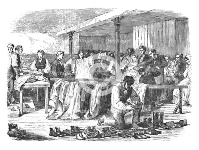 'The Cotton Famine: Distribution of Clothes to Operatives, Manchester', 1904. Artist: Unknown.