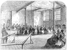 The Cotton Famine: waiting-room at the district provident institution, Manchester, 1862. Creator: Unknown