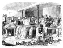 The Cotton Famine: the Manchester and Salford Provident Society distributing clothing, 1862. Creator: Unknown