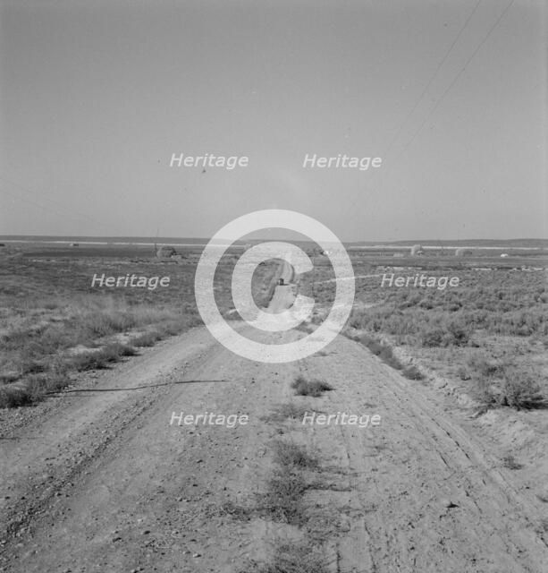 The cream truck coming down the road..., Nyssa Heights, Malheur County, Oregon, 1939. Creator: Dorothea Lange.