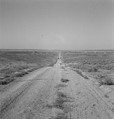 The cream truck coming down the road..., Nyssa Heights, Malheur County, Oregon, 1939. Creator: Dorothea Lange