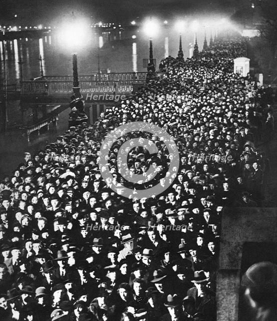 The crowd waiting to pass by King George V's catafalque in Westminster Hall,  London, January 1936. Artist: Unknown