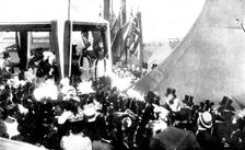 The Duchess of York christening the "Albion", 1898. Creator: Russell & Sons