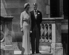 The Duke and Duchess of Windsor Standing in the Grounds of the Chateau de Candé, 1937. Creator: British Pathe Ltd