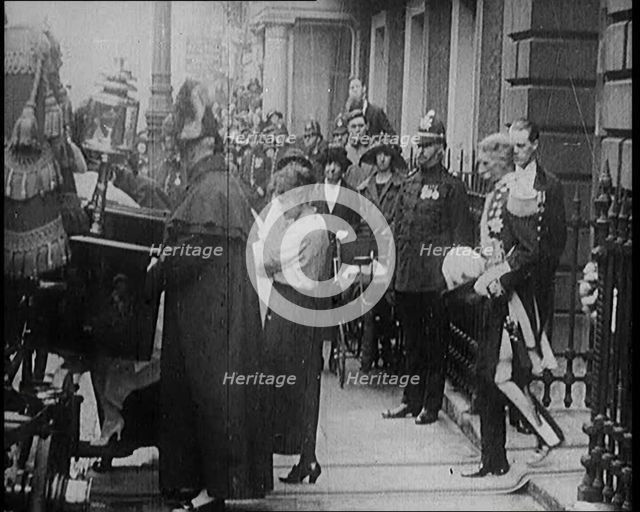 The Duke of York and Lady Elizabeth Bowes-Lyon Emerging from a House and Embarking on a..., 1920. Creator: British Pathe Ltd.