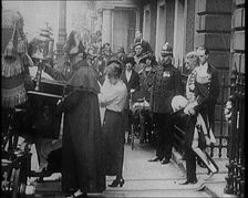 The Duke of York and Lady Elizabeth Bowes-Lyon Emerging from a House and Embarking on a..., 1920. Creator: British Pathe Ltd