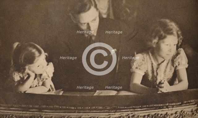 The Duke of York and Princesses Elizabeth and Margaret at the pantomime, 6 February 1935.  Artist: Unknown.