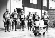 The Duncan’s factory decontamination unit dressed in their suits, Edinburgh, Scotland,1941