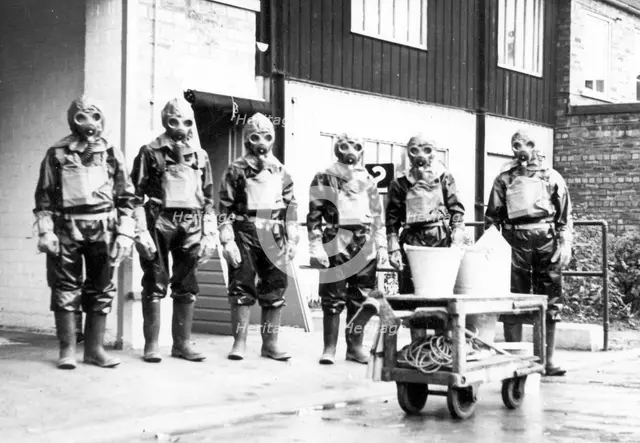 The Duncan’s factory decontamination unit dressed in their suits, Edinburgh, Scotland,1941. Artist: Unknown