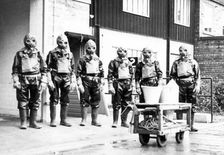 The Duncan’s factory decontamination unit dressed in their suits, Edinburgh, Scotland,1941
