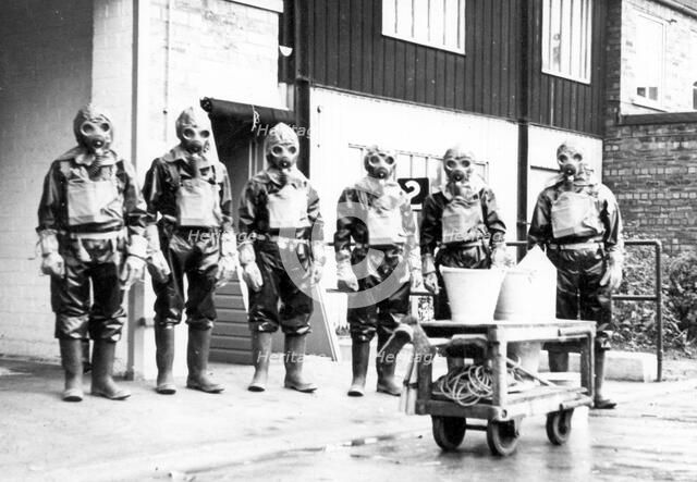The Duncan’s factory decontamination unit dressed in their suits, Edinburgh, Scotland,1941. Artist: Unknown