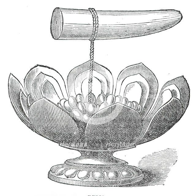 The Dalada, or tooth relic of Buddha, and golden lotus flower in the Maligawa Temple, Kandy..., 1876 Creator: Unknown.