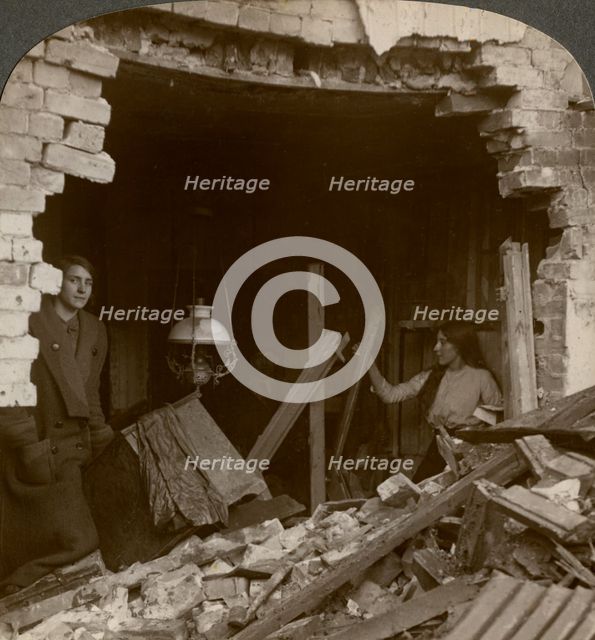 The damage done by a German Zeppelin bomb, World War I, 1914-1918.Artist: Realistic Travels Publishers