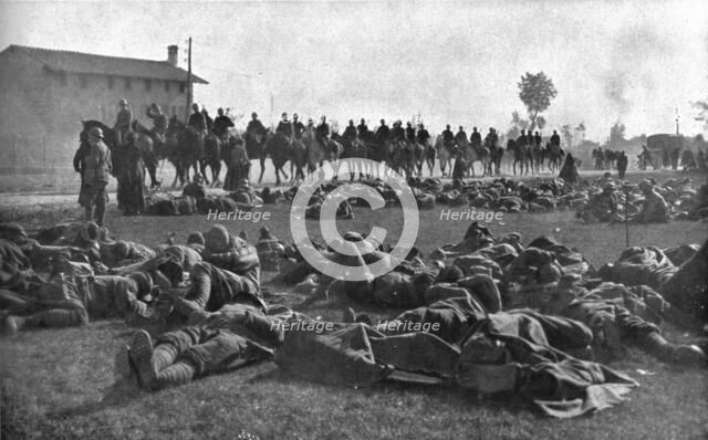 The Dark Hours of Italy; Detachment of infantry, exhausted, resting under protection... 1917. Creator: Unknown.