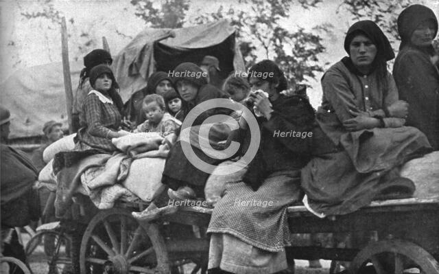 The Dark Hours of Italy; Women and children of Friuli and Carnia fleeing..., 1917. Creator: Unknown.