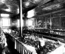 The Destruction of Spurgeon's Tabernacle: remains of the supper preparations, lecture-hall, 1898. Creator: Thiele & Co