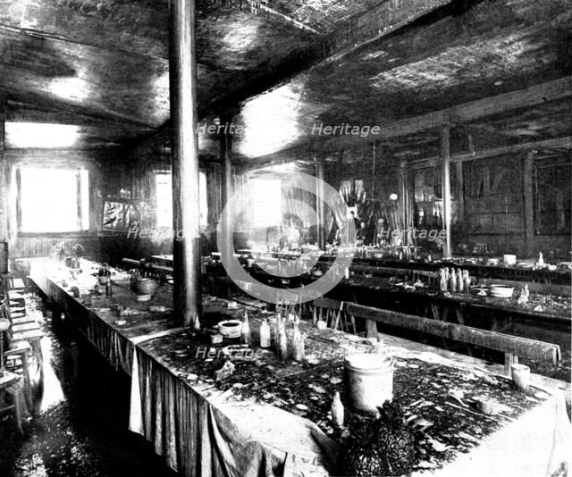 The Destruction of Spurgeon's Tabernacle: remains of the supper preparations, lecture-hall, 1898. Creator: Thiele & Co.