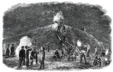 The Deptford Rifle Corps (34th Kent) forming earthworks for their shooting-ground by torchlight,1860 Creator: Unknown