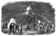 The Deptford Rifle Corps (34th Kent) forming earthworks for their shooting-ground by torchlight,1860 Creator: Unknown