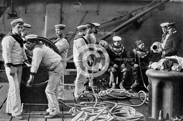 The diver on board ship, 1896. Artist: Gregory & Co