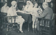 The Doctor listening to a child's heart beat c1935