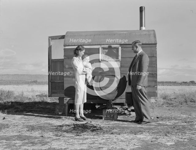 The doctor reassures the mother after having seen the sick..., Merrill, Klamath County, Oregon, 1939 Creator: Dorothea Lange.
