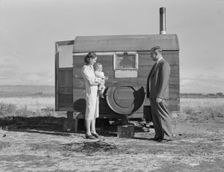 The doctor reassures the mother after having seen the sick..., Merrill, Klamath County, Oregon, 1939 Creator: Dorothea Lange
