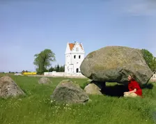 The dolmen and the Church of Skegrie, Scania, Sweden. Creator: Göran Algård