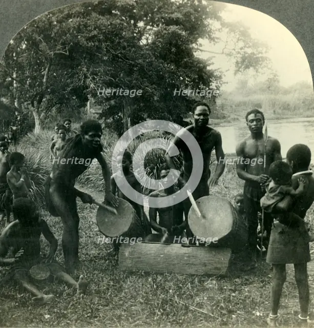 'The Drums of Africa - in the Village of Ikoko on Lake Ntomba in Belgian Congo', c1930s. Creator: Unknown.