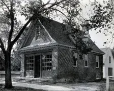 The exterior of a small brick building used as an apothecary shop..., c1900. Creator: Unknown