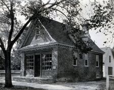 The exterior of a small brick building used as an apothecary shop..., c1900. Creator: Unknown