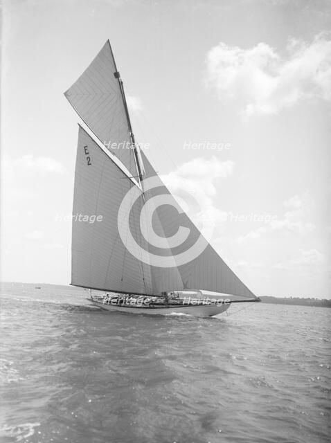 The early 12 Metre cutter 'Cintra' sailing close-hauled, 1911. Creator: Kirk & Sons of Cowes.
