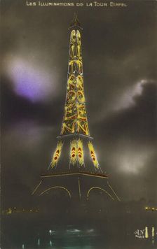The Eiffel tower at Night, c. 1925. Creator: Anonymous