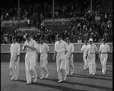 The English Cricket Team Coming Out to Play in Ashes Test in Front of a Large Crowd, 1929. Creator: British Pathe Ltd
