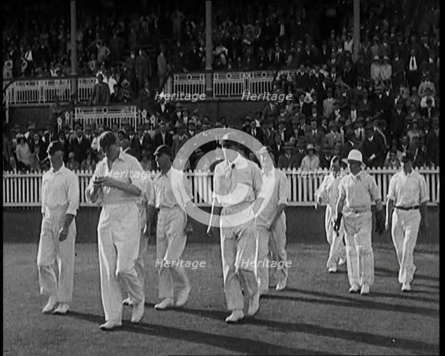 The English Cricket Team Coming Out to Play in Ashes Test in Front of a Large Crowd, 1929. Creator: British Pathe Ltd.