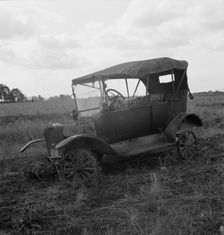 The end of the Model "T" abandoned...along Highway 99, North of Eugene, Oregon, 1939. Creator: Dorothea Lange
