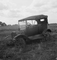 The end of the Model "T" abandoned...along Highway 99, North of Eugene, Oregon, 1939. Creator: Dorothea Lange