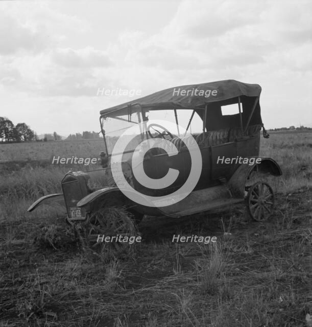 The end of the Model "T" abandoned...along Highway 99, North of Eugene, Oregon, 1939. Creator: Dorothea Lange.