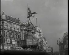The Eros Statue in Piccadilly Circus With Neon Advertising Lights on the Buildings Behind..., 1939. Creator: British Pathe Ltd