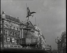 The Eros Statue in Piccadilly Circus With Neon Advertising Lights on the Buildings Behind..., 1939. Creator: British Pathe Ltd