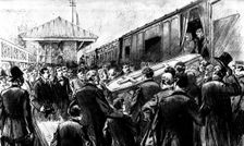 The Funeral of Mr. Gladstone: placing the body in the train at Broughton Hall Station, 1898. Creator: Unknown