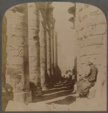 The famous colonnade of the great Hypostyle Hall in the Temple of Karnak, Thebes, Egypt 1897. Creator: Underwood & Underwood