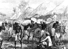 The Famine in Bengal: loading grain-carts near Calcutta, 1874. Creator: Unknown