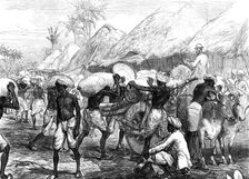 The Famine in Bengal: loading grain-carts near Calcutta, 1874. Creator: Unknown