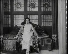 The Female Actor Josie Collins Performing in a Play With Two Male Actors, 1920s. Creator: British Pathe Ltd