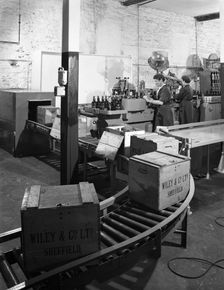 The final stages of bottling whisky at Wiley & Co, Sheffield, South Yorkshire, 1960. Creator: Michael Walters
