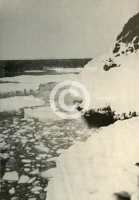 'The First Landing-Place, Showing Bay Ice Breaking Out and Drifting Away North', 1908, (1909). Artist: Unknown.