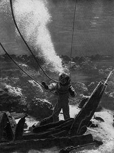 The first photograph of a diver under water, late 19th century, (c1920)