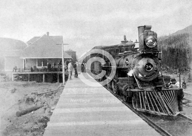 The first regular trans-continental train at Fernie, British Columbia, Canada, 1886 (1951). Artist: Unknown