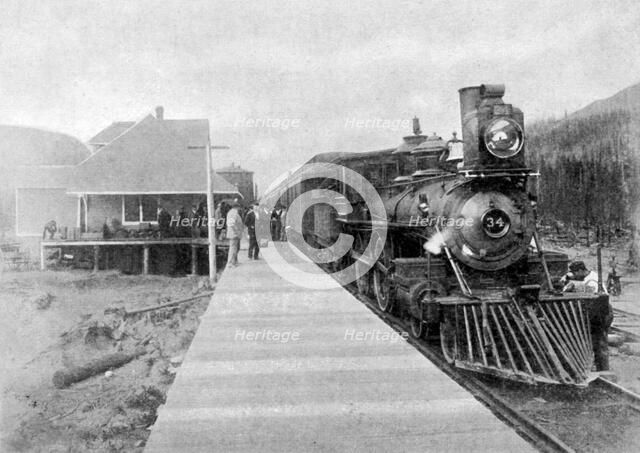 The first regular trans-continental train at Fernie, British Columbia, Canada, 1886 (1951). Artist: Unknown